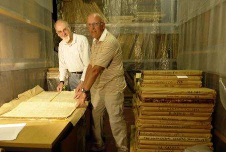 Volunteers work on the KM Group's digital archive project