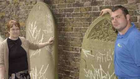 SAD SIGHT: Amenities manager Jenny Neesan and council workman James Mitchell examine the graffiti. Picture: ANDY PAYTON