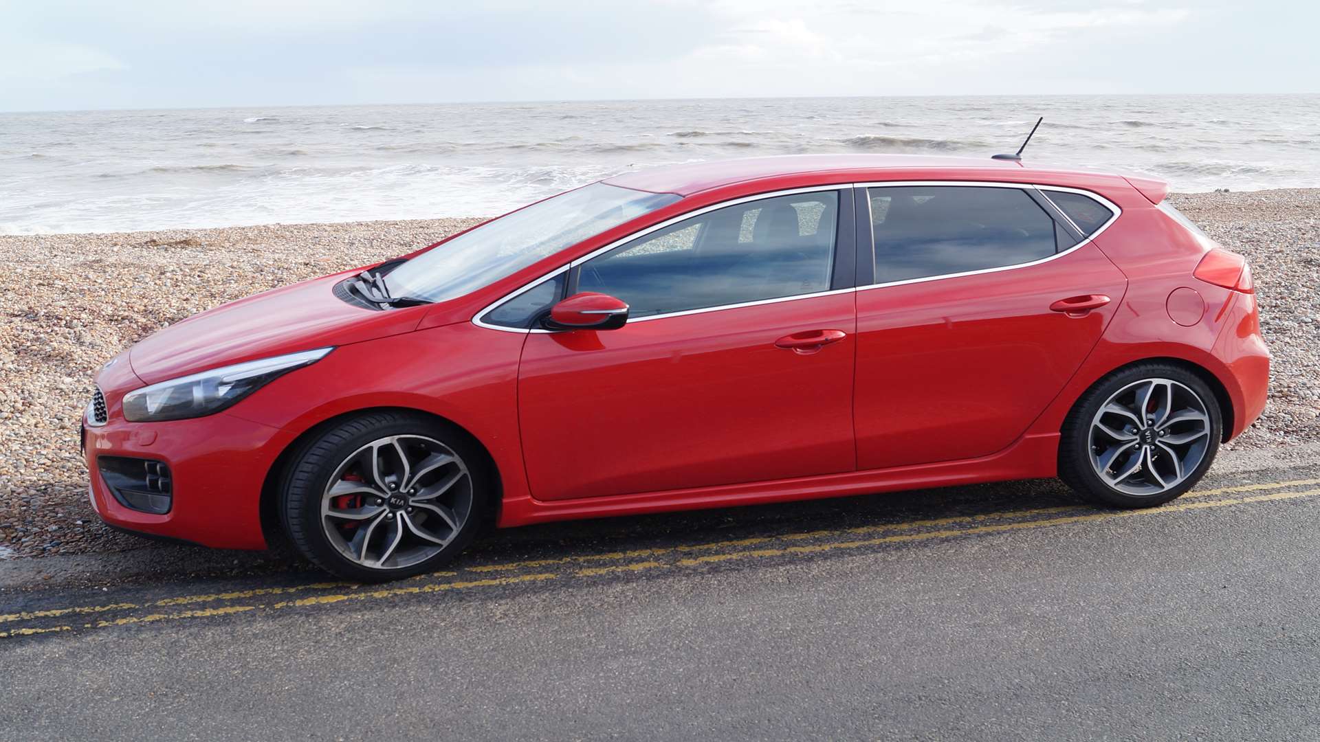 Red brake calipers sit behind the handsome 18in alloys which fill the arches