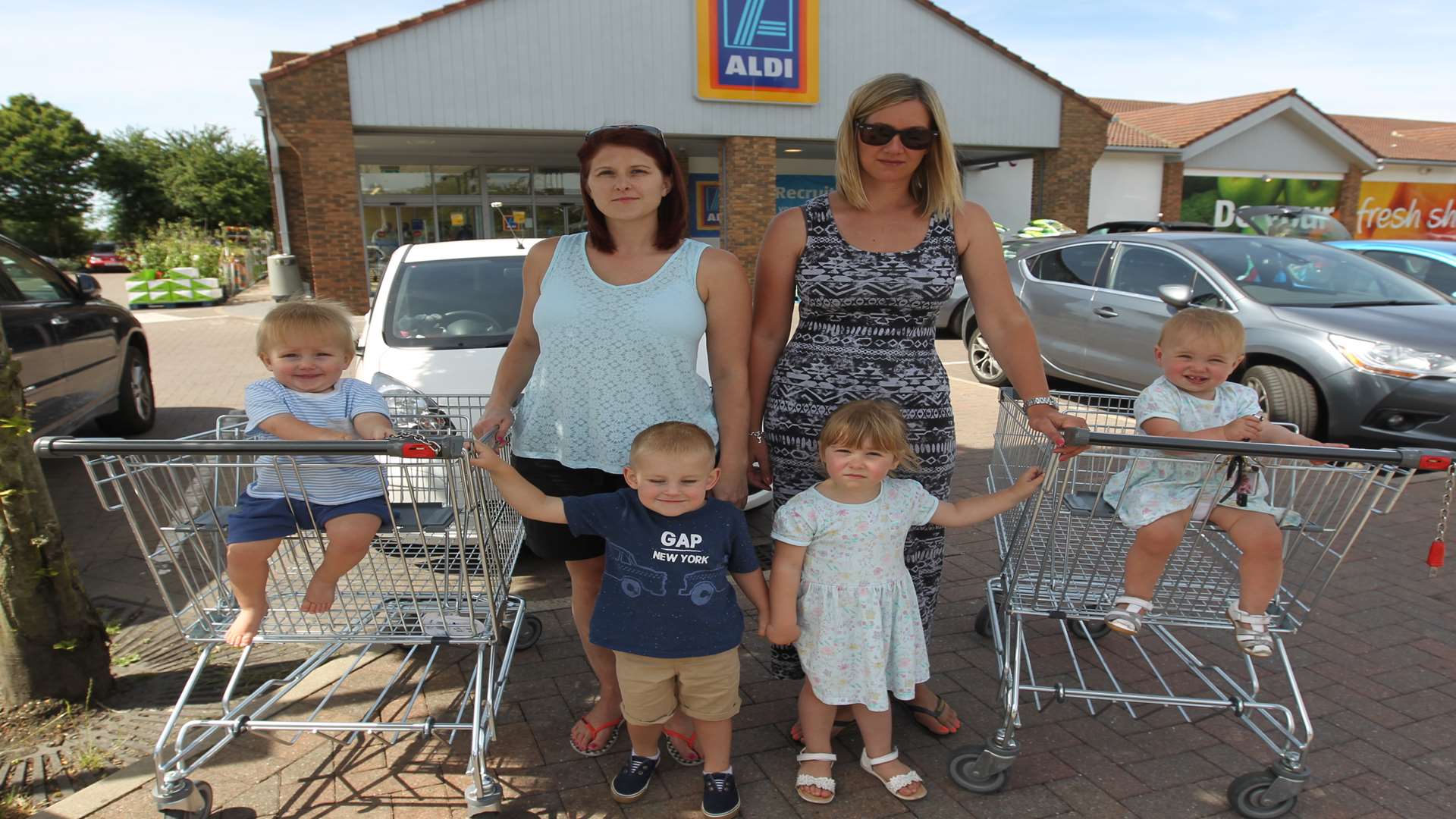 Natalie Hibberd with her children, Keir, one and Leo, three with support from Georgia Storey and her children, Florence, three and Rose, 14 months