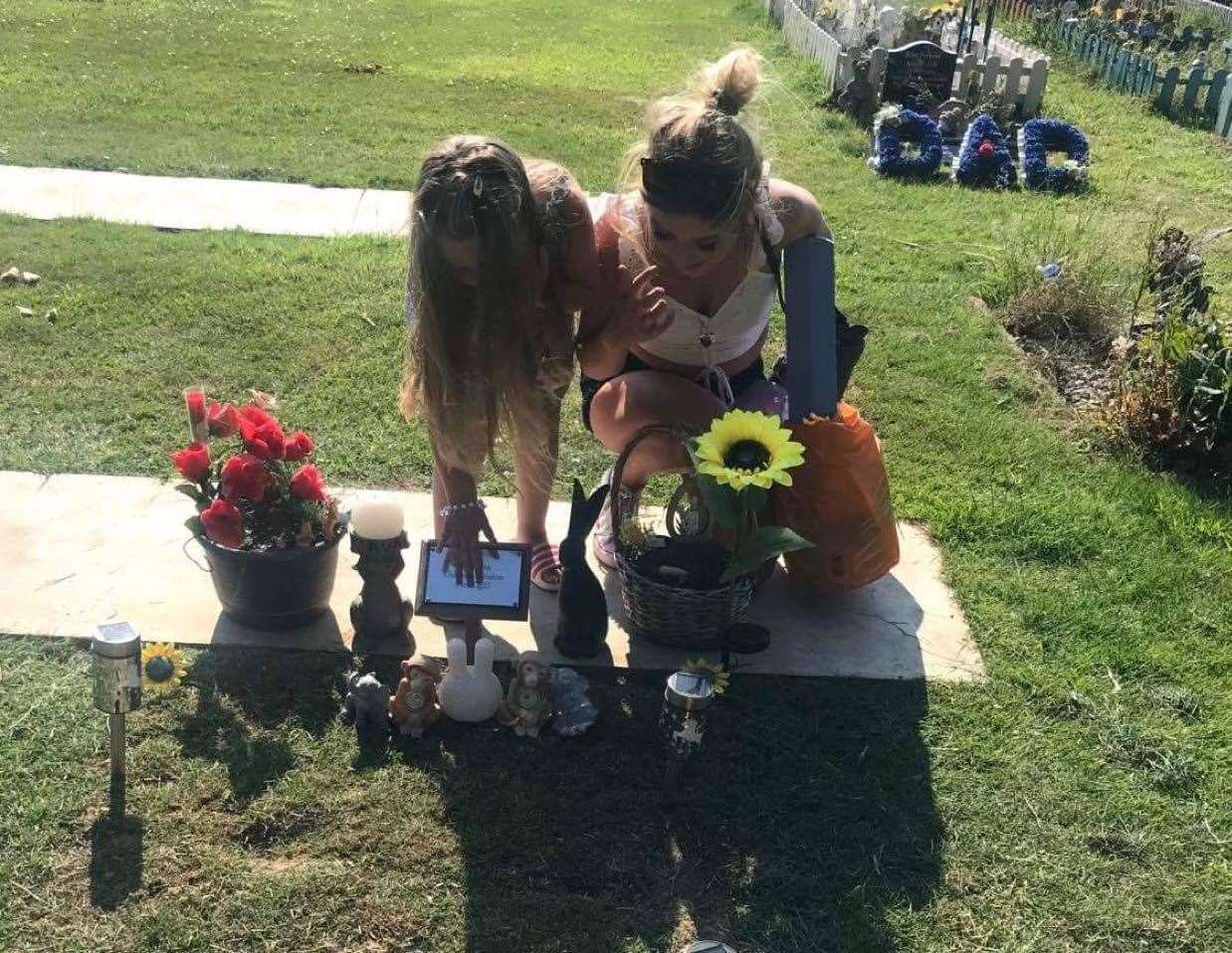 The family visit Ava's grave every week