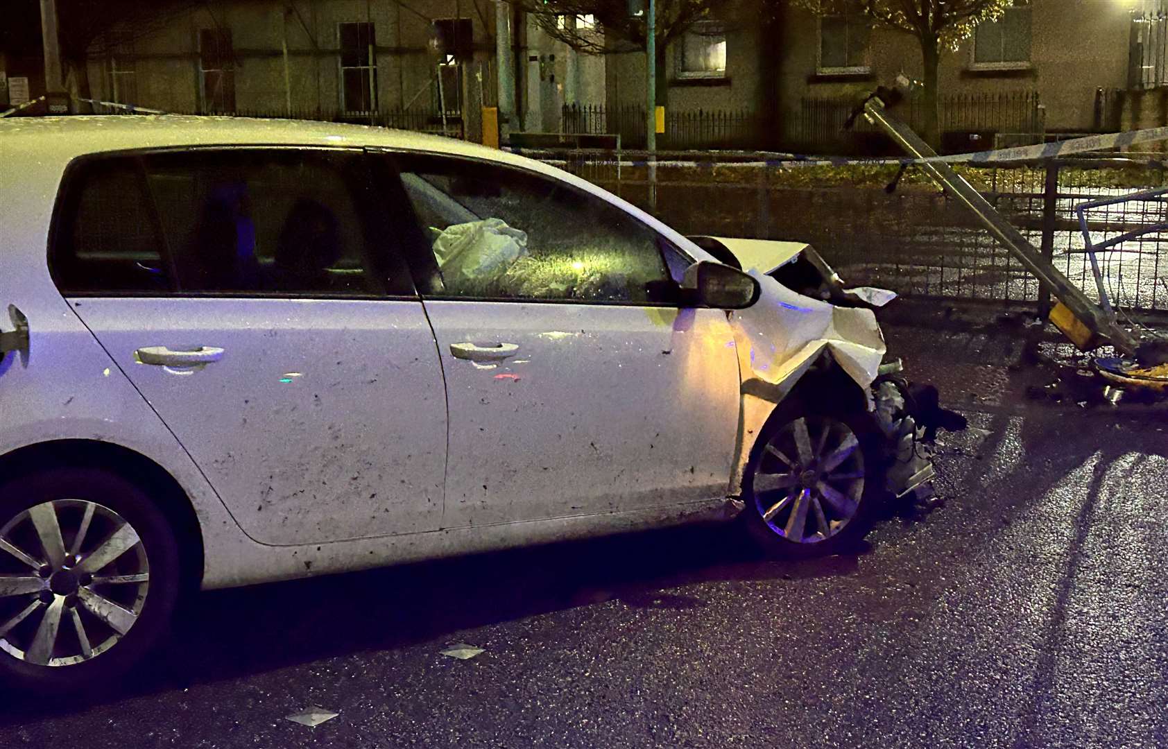 The car was mangled and caused damage to the metal railings