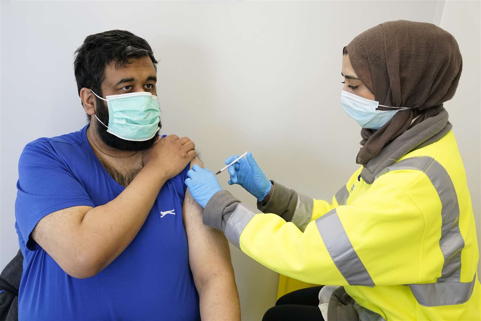 Riswan Mahmood receives his Covid-19 vaccination at the Penny Street vaccination centre in Blackburn (Danny Lawson/PA)