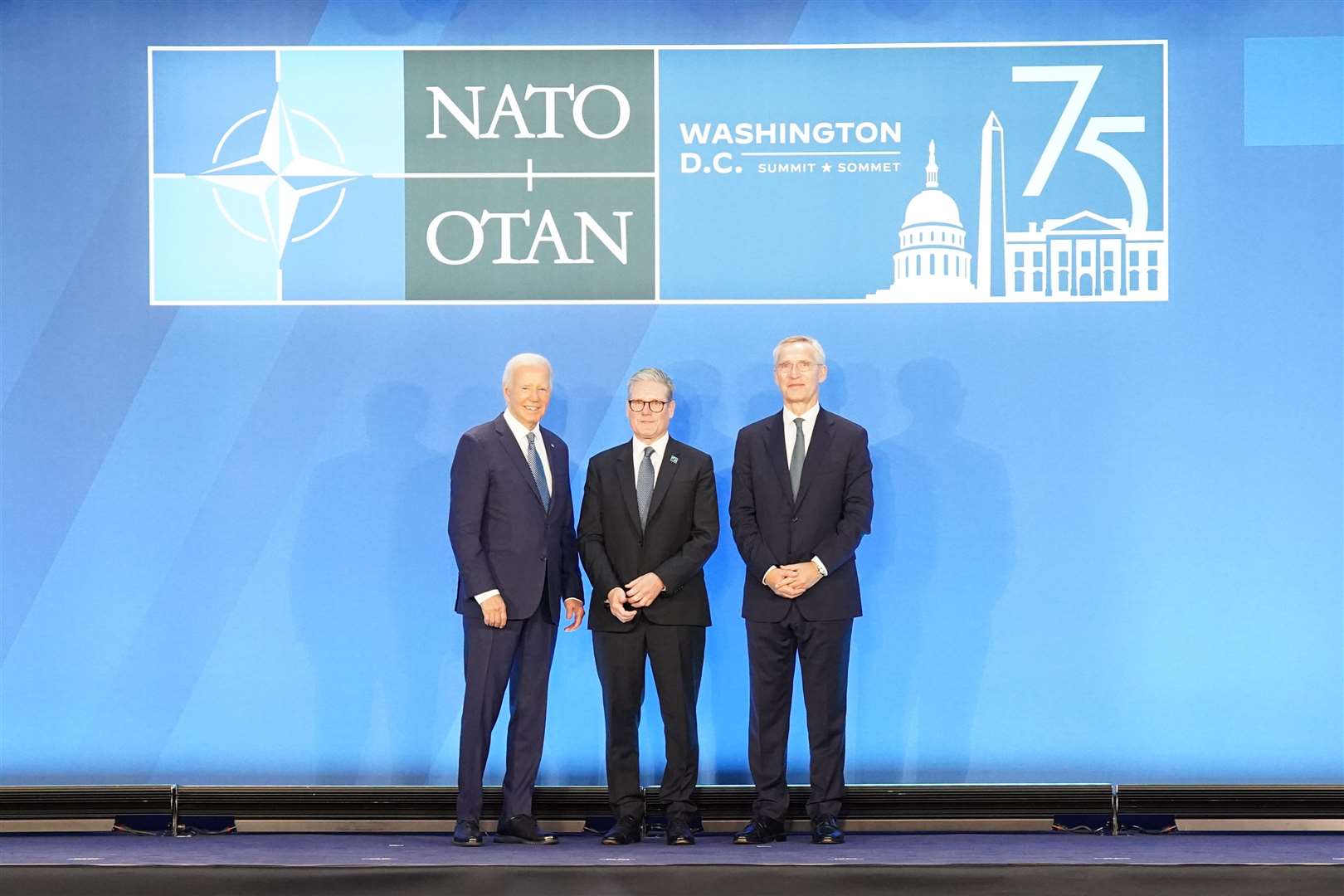 The two world leaders alongside Nato secretary-general Jens Stoltenberg (Stefan Rousseau/PA)