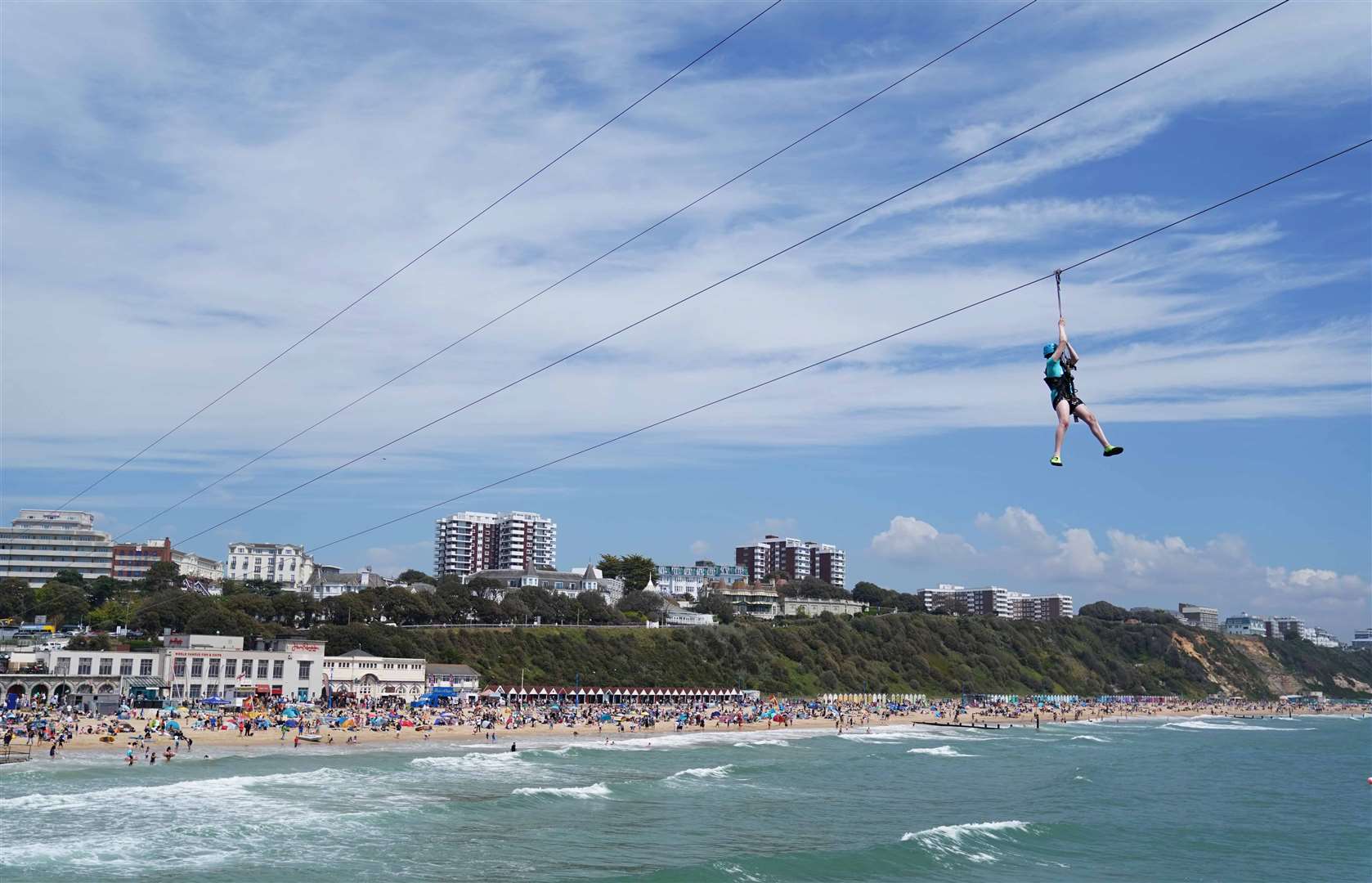 Zip-lining across the sea from Bournemouth pier (Andrew Matthews/PA)