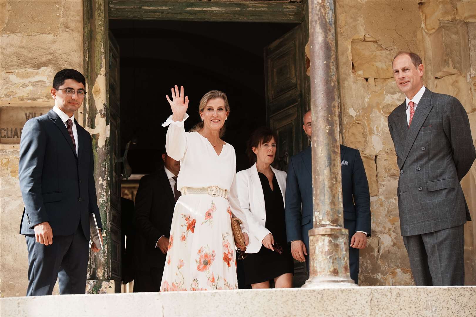 The duchess waved to a small crowd that had gathered outside the villa (Aaron Chown/PA)