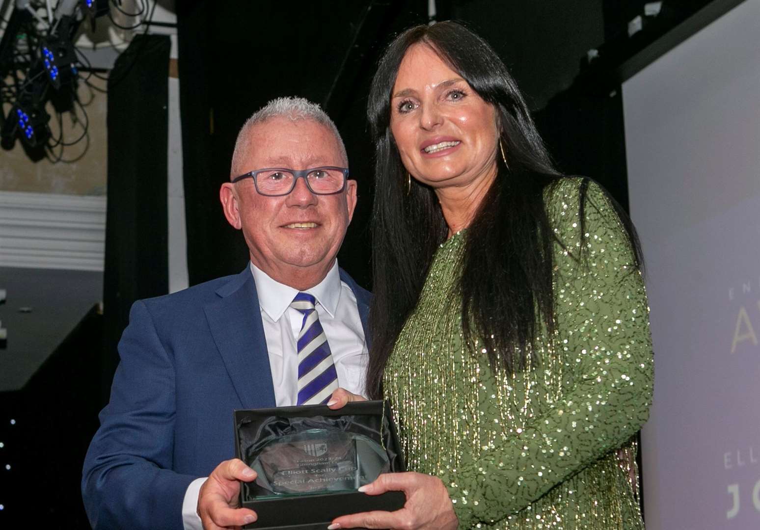 Club director Paul Scally with the Elliot Scally Trophy for Jo Binks Picture: @Julian_KPI