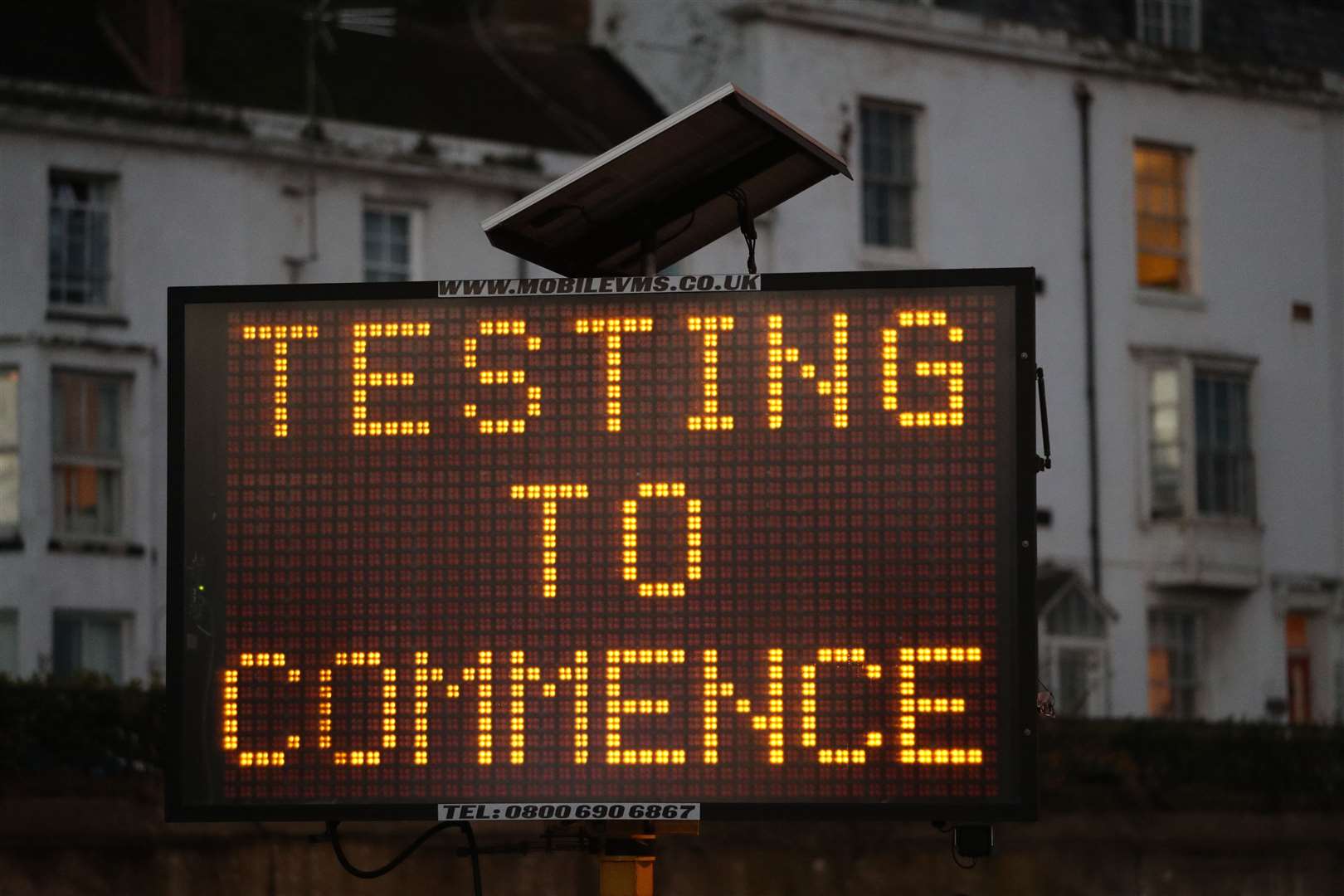 A dot matrix sign informs lorry drivers that Covid testing is about to begin at the entrance to the Port of Dover in Kent (Andrew Matthews/PA)