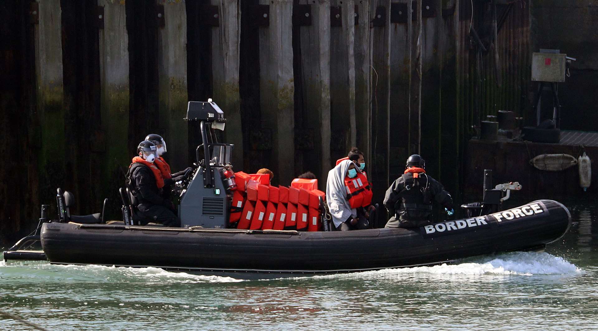 Border Force officers bring to shore men thought to be migrants in Dover (Gareth Fuller/PA)