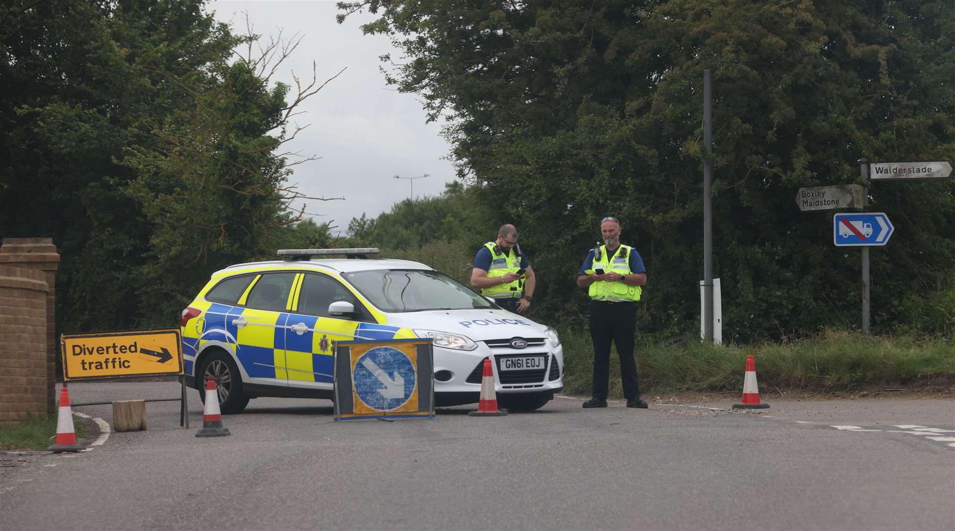 Police block off the entrance to the road. Picture: UKNiP