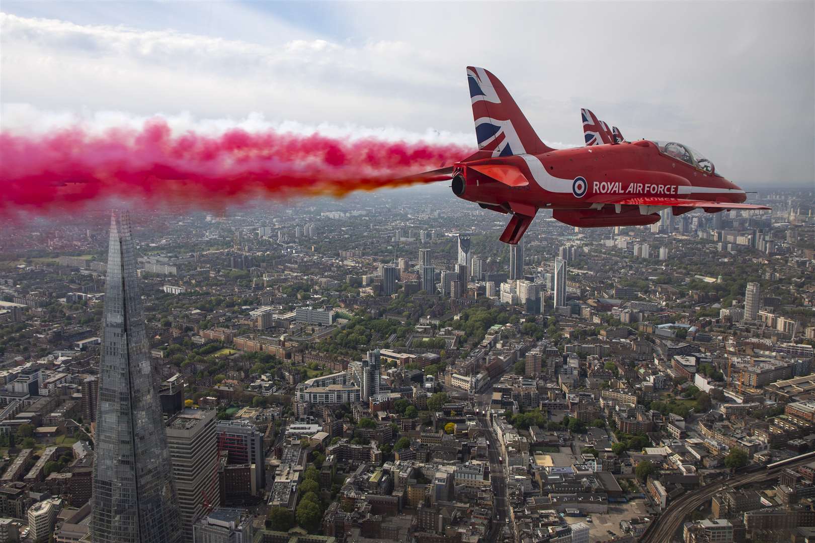 The Royal Air Force Red Arrows flying over the City in London during a flypast in central London to mark the 75th anniversary of VE Day (SAC Hannah Smoker/MoD/Crown Copyright/PA)