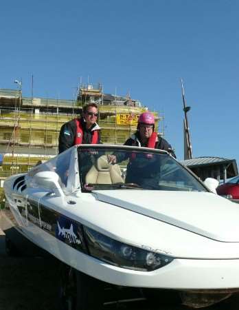 Prof Hans Georg Nader, right, and Henry Hawkins prepare to leave Dover for the attempt to make the fastest Channel crossing in an amphibious car