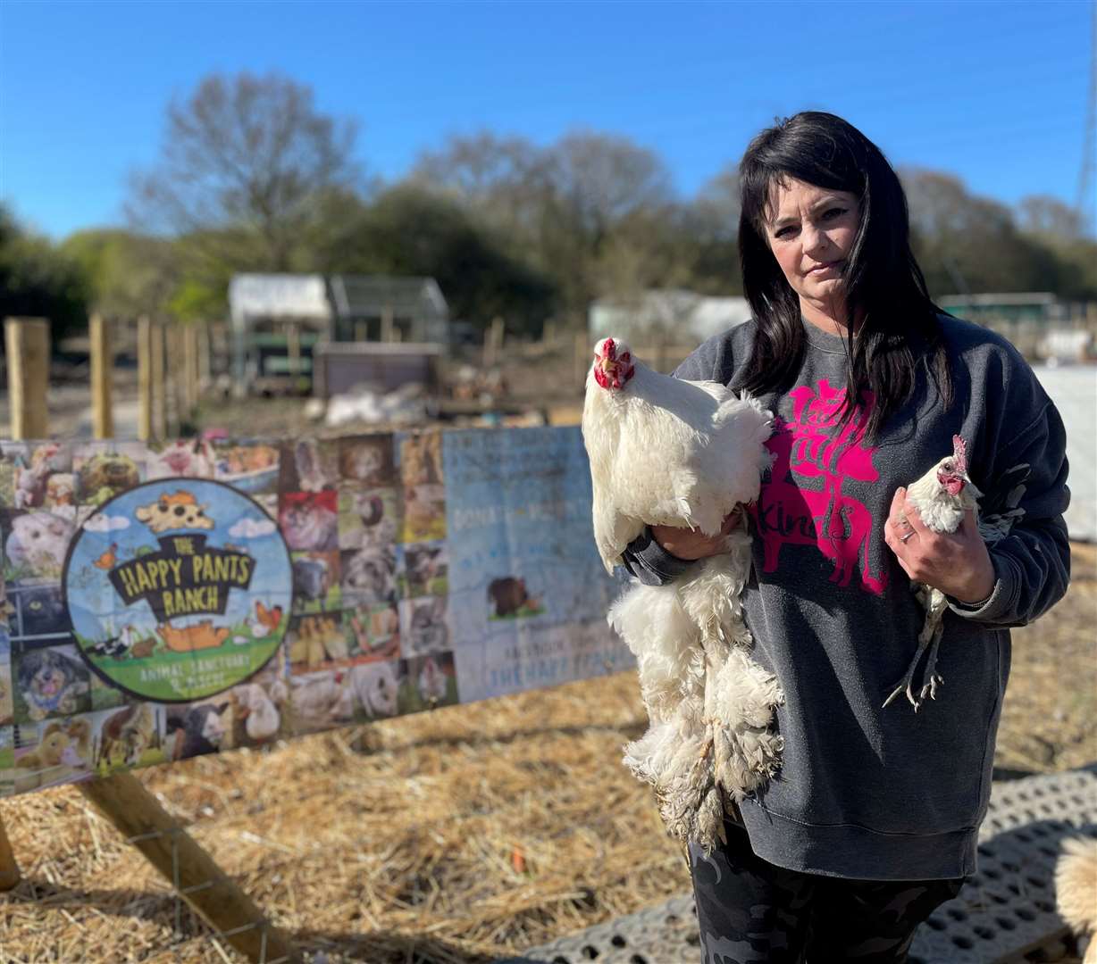 Founder Amey James, with cockerels, at The Happy Pants Ranch animal sanctuary in Iwade Lane, Bobbing. Picture: Chloe Holmwood