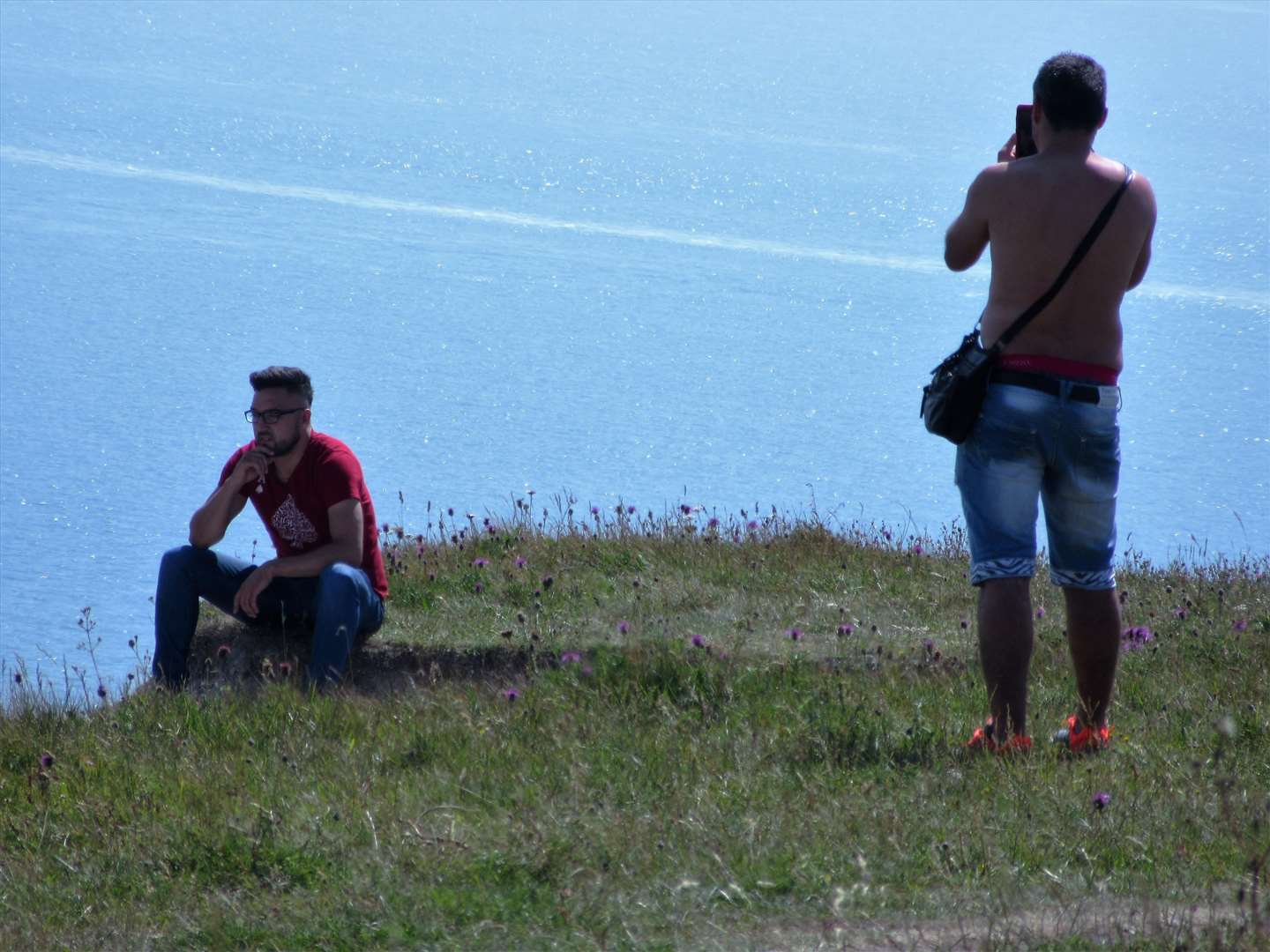 A man sits on the brink to be photographed, 2017. Picture: Ted Prangnell.