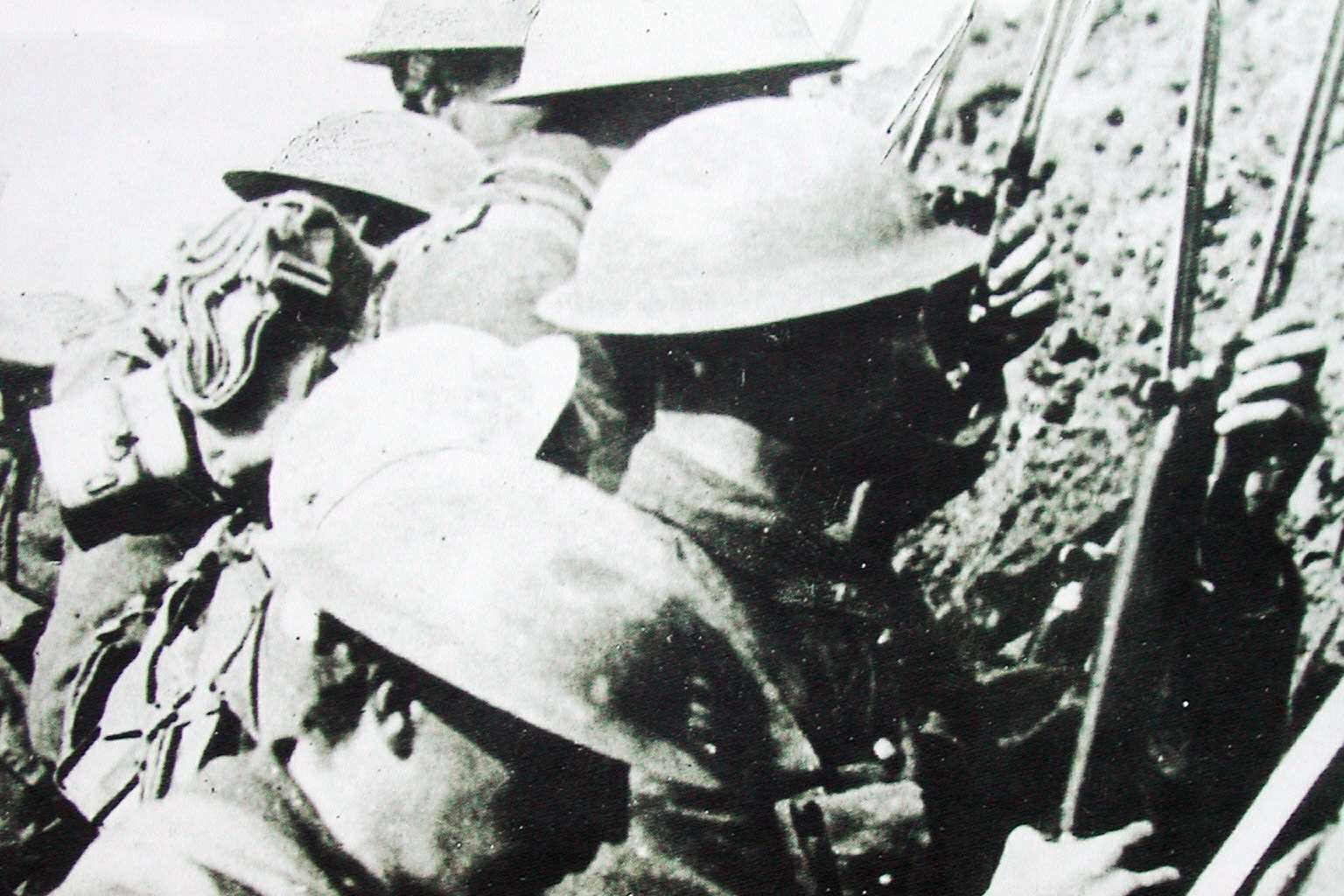 British troops fix bayonets as they prepare to go over the top