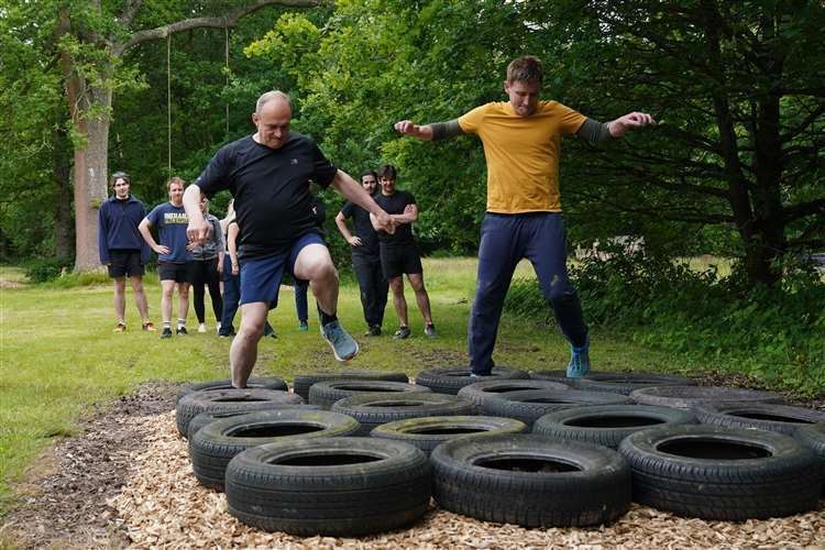 Liberal Democrat leader Sir Ed Davey (left) and the party’s parliamentary candidate for Tunbridge Wells Mike Martin race each other on an assault course in Kent (Gareth Fuller/PA)