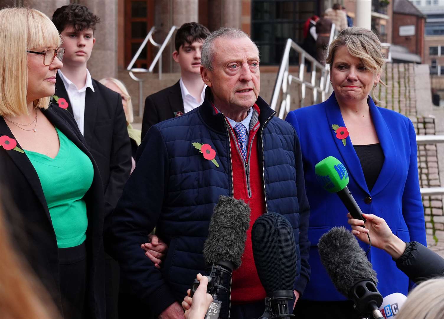 Patrick O’Hara (centre) stands with family members as he speaks to the media outside Newcastle Crown Court (Owen Humphreys/PA)