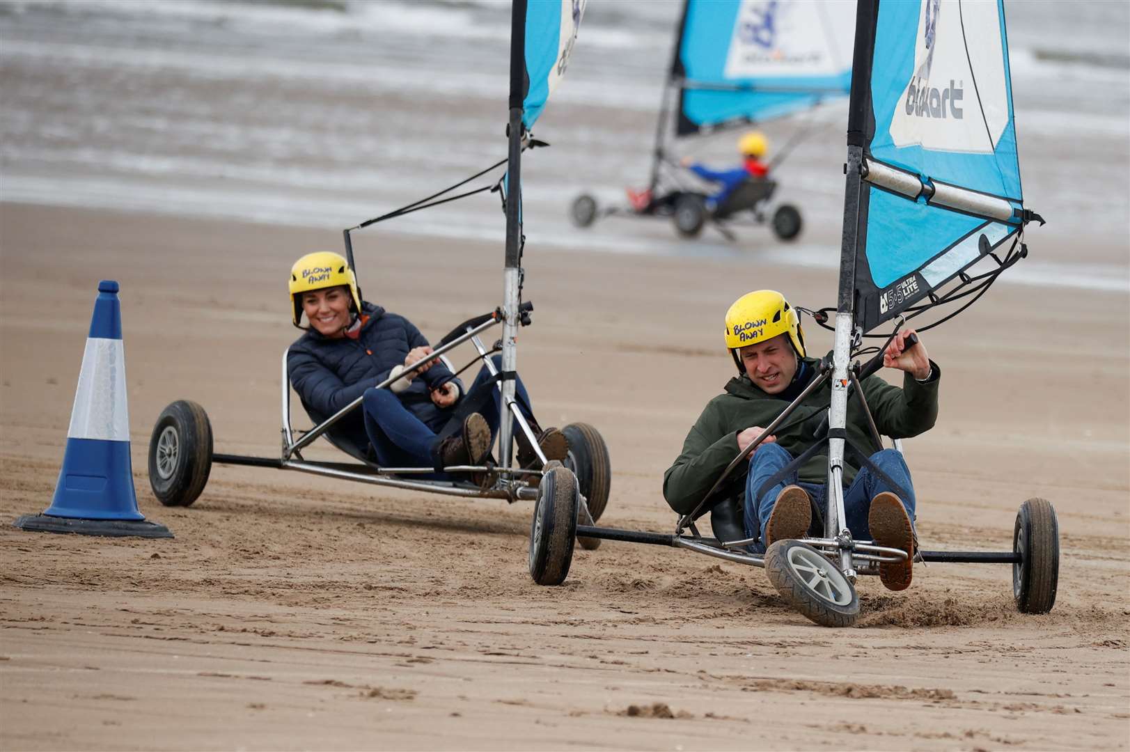 The royal couple raced each other across the sands (Phil Noble/PA)