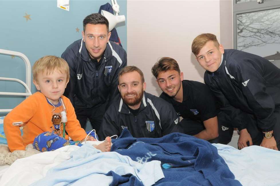 Dolphin Ward, Medway Maritime Hospital, Gillingham. Gills football squad visit the children. L-R: Miles Greenwood with Joe Martin- Charlie Lee- Bradley Dack- Jake Hessenthaler