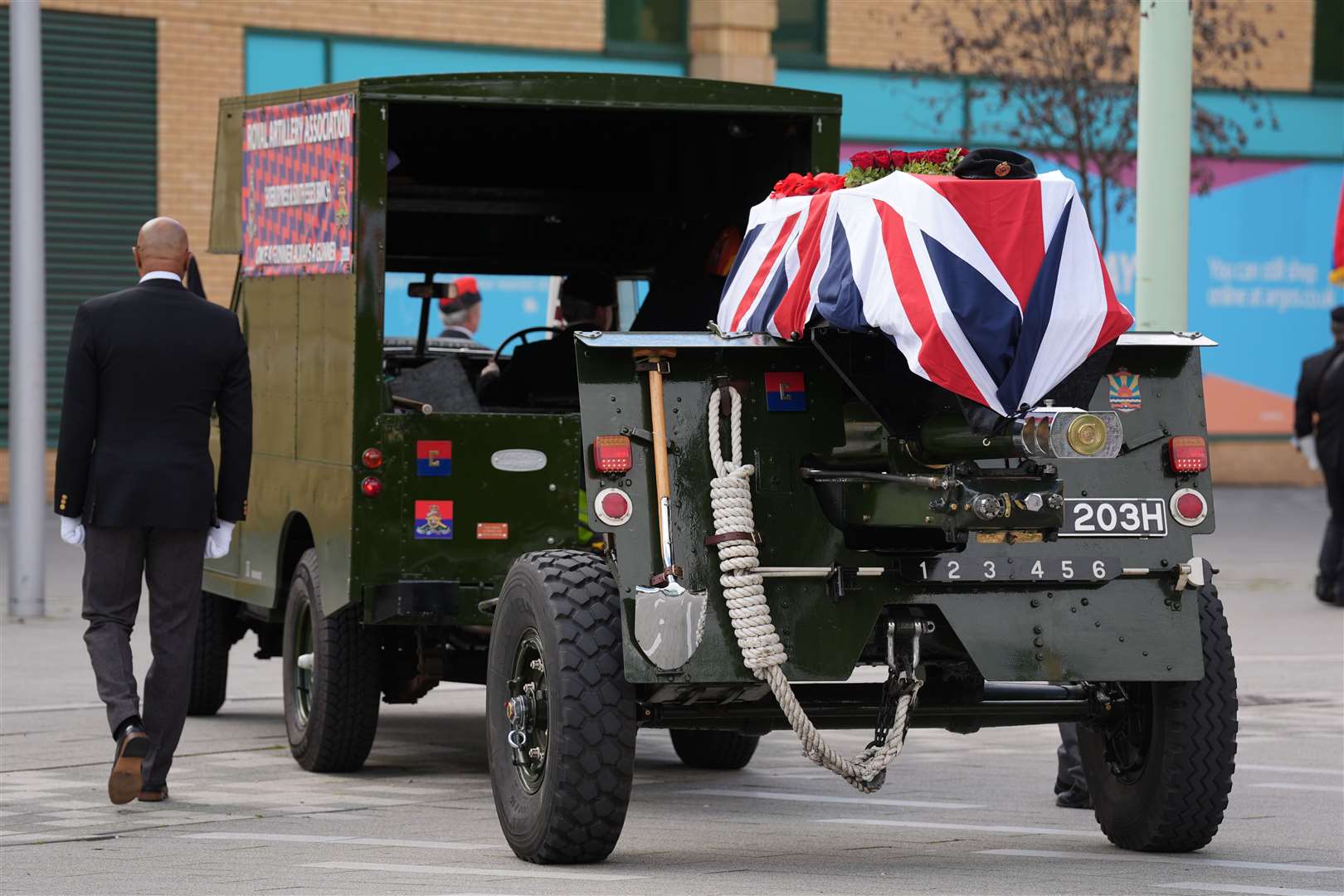 The coffin, draped in the union flag, is escorted on a gun carriage (Lucy North/PA)