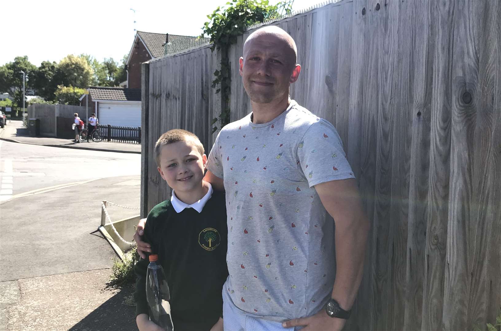 John Deacon with son Oscar outside Sittingbourne's Lansdowne Primary School