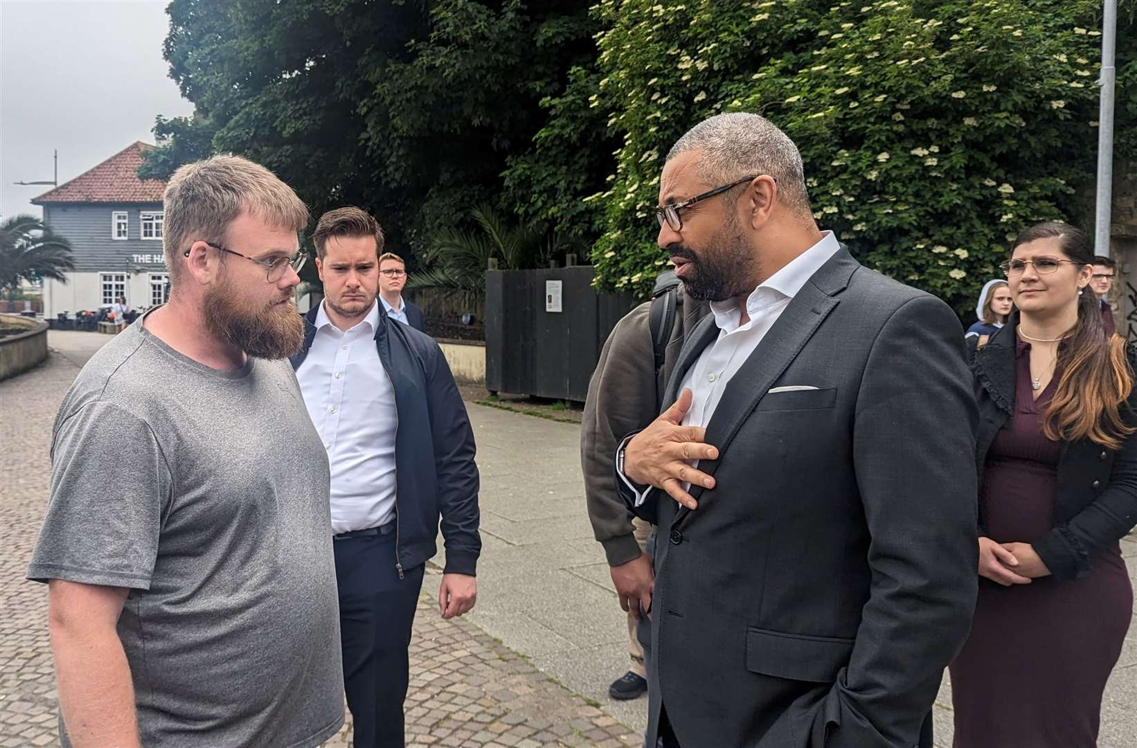 James Cleverly speaking with a local resident about Gaza and arms sales to Israel during a campaign visit to Folkestone