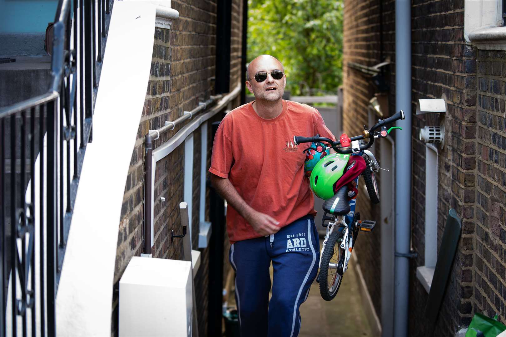 Dominic Cummings leaving his north London home carrying his son’s bike on Saturday (Aaron Chown/PA)