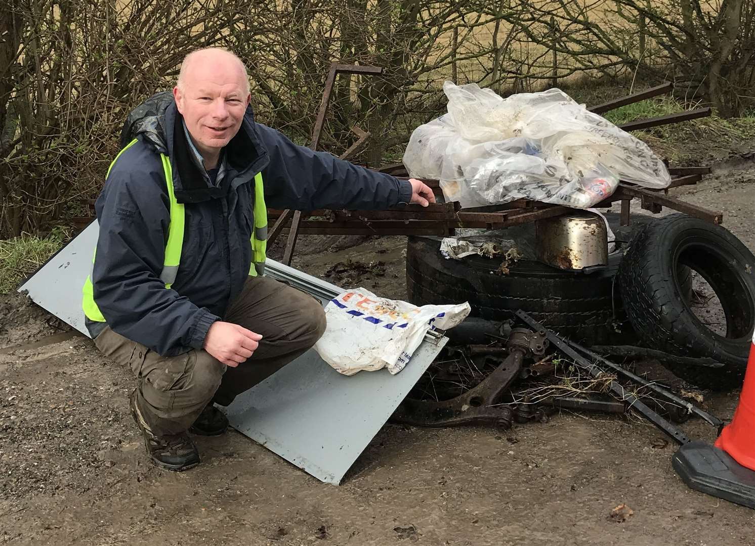 Cllr Mike Sole next to a collection of rubbish that had previously been dumped at spots across Bishopsbourne