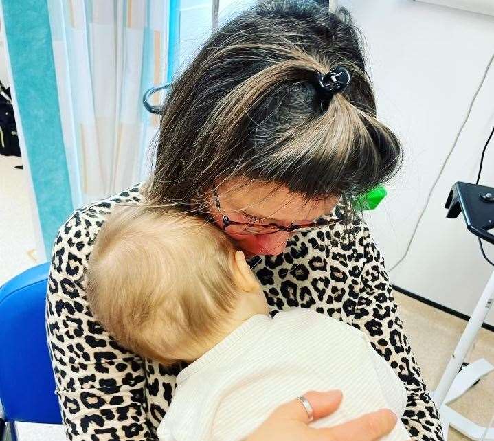 Teddy enjoying cuddles with nanny Sue for her birthday at Great Ormond Street Hospital for Children in London