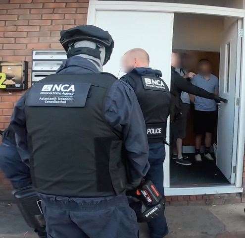 NCA officers arrest a man in Catford Picture: NCA