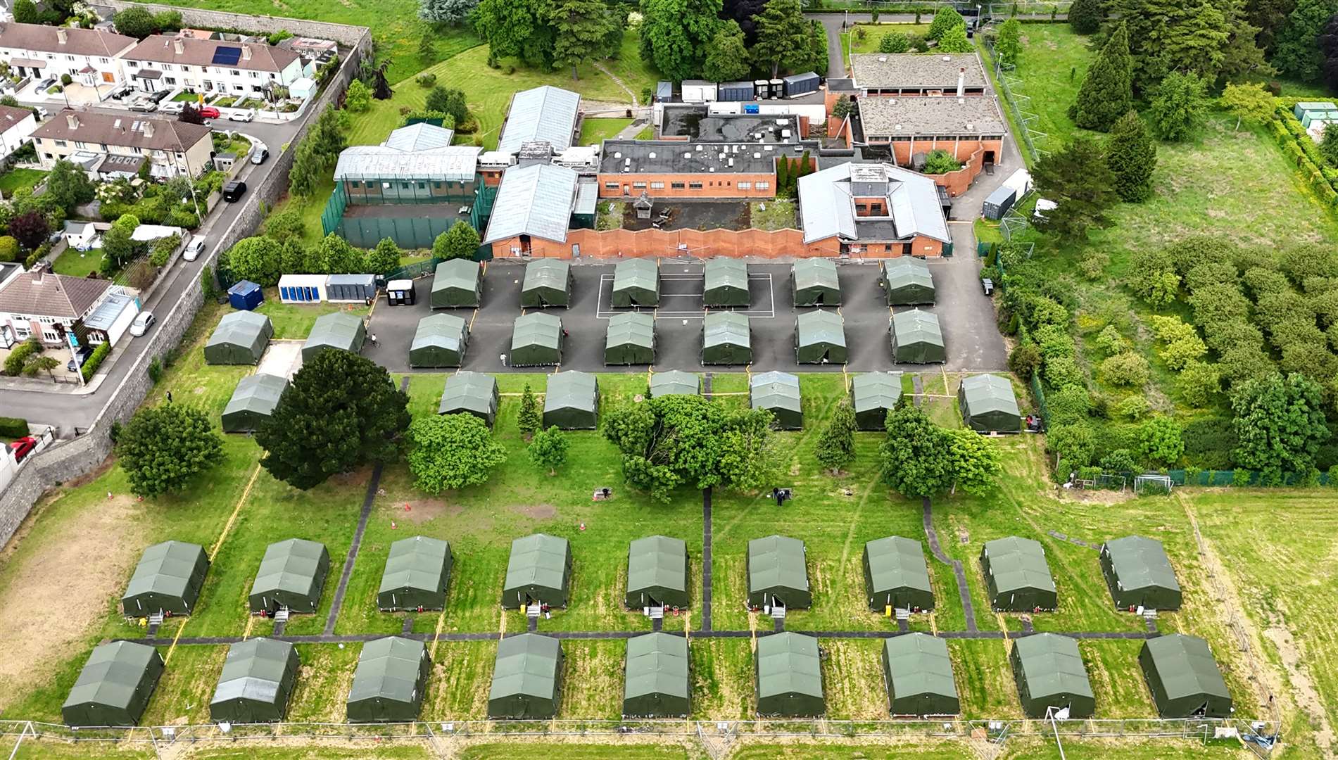 Some of the tents at the former Central Mental Hospital have been pitched on tennis courts and a football pitch (Niall Carson/PA)