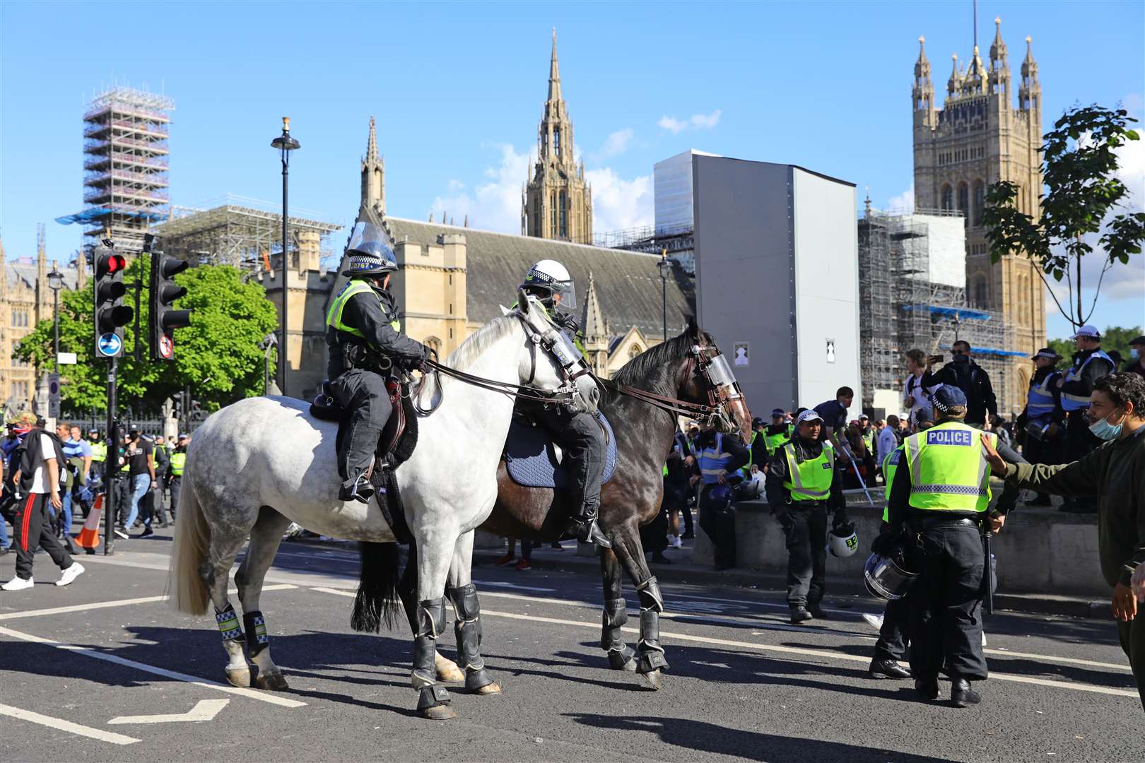 Mounted police watch over protesters in Parliament Square last Saturday (Aaron Chown/PA)