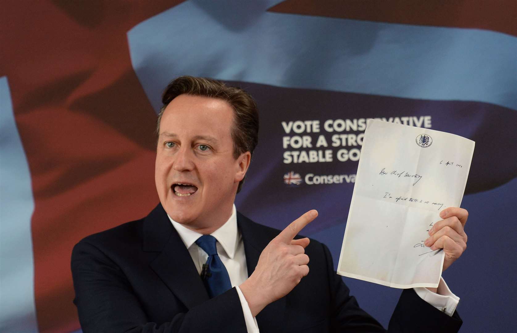 Then-PM David Cameron holds up the note Liam Byrne left on his Treasury desk after Labour’s 2010 election defeat (Stefan Rousseau/PA)