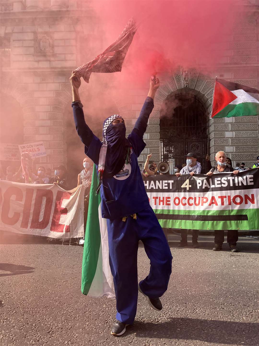 A protester lets off a flare (Jacob Freedland/PA)