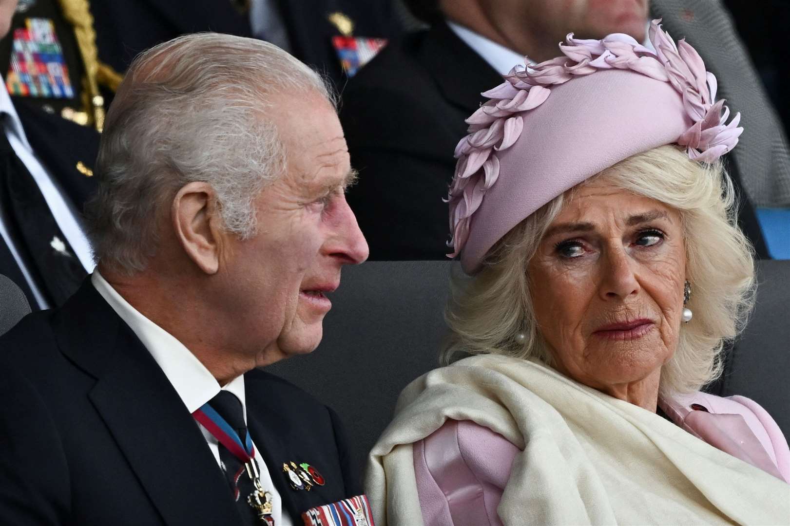 The King and Queen appeared moved by the poignant commemorations for the 80th anniversary of D-Day in Portsmouth in June (Dylan Martinez/PA)