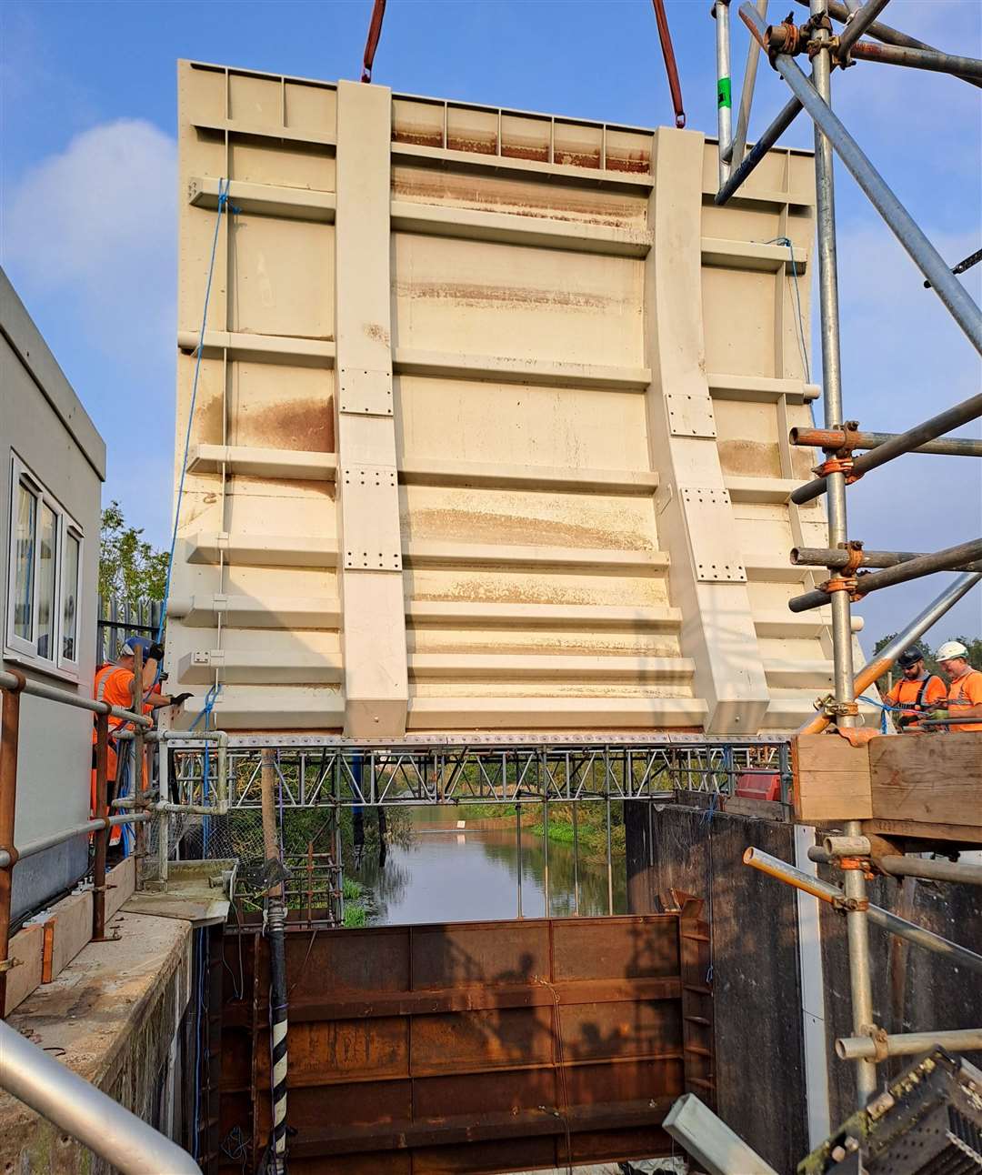 Lowering the 12.5-ton gate into position was a delicate process at the Leigh Storage Area