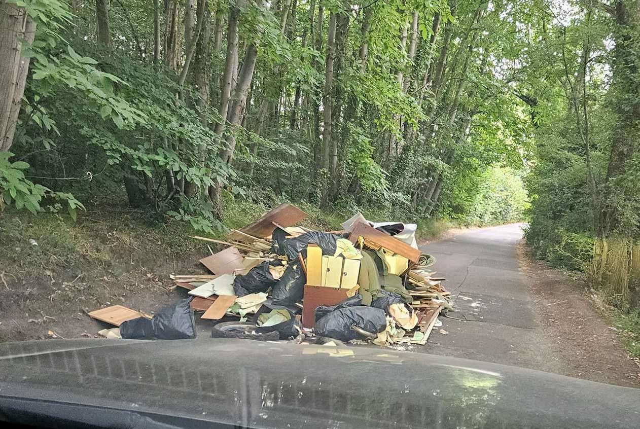 The country lane in Crockenhill was blocked after a pile of rubbish, including furniture, was dumped. Picture: Warren Knapp