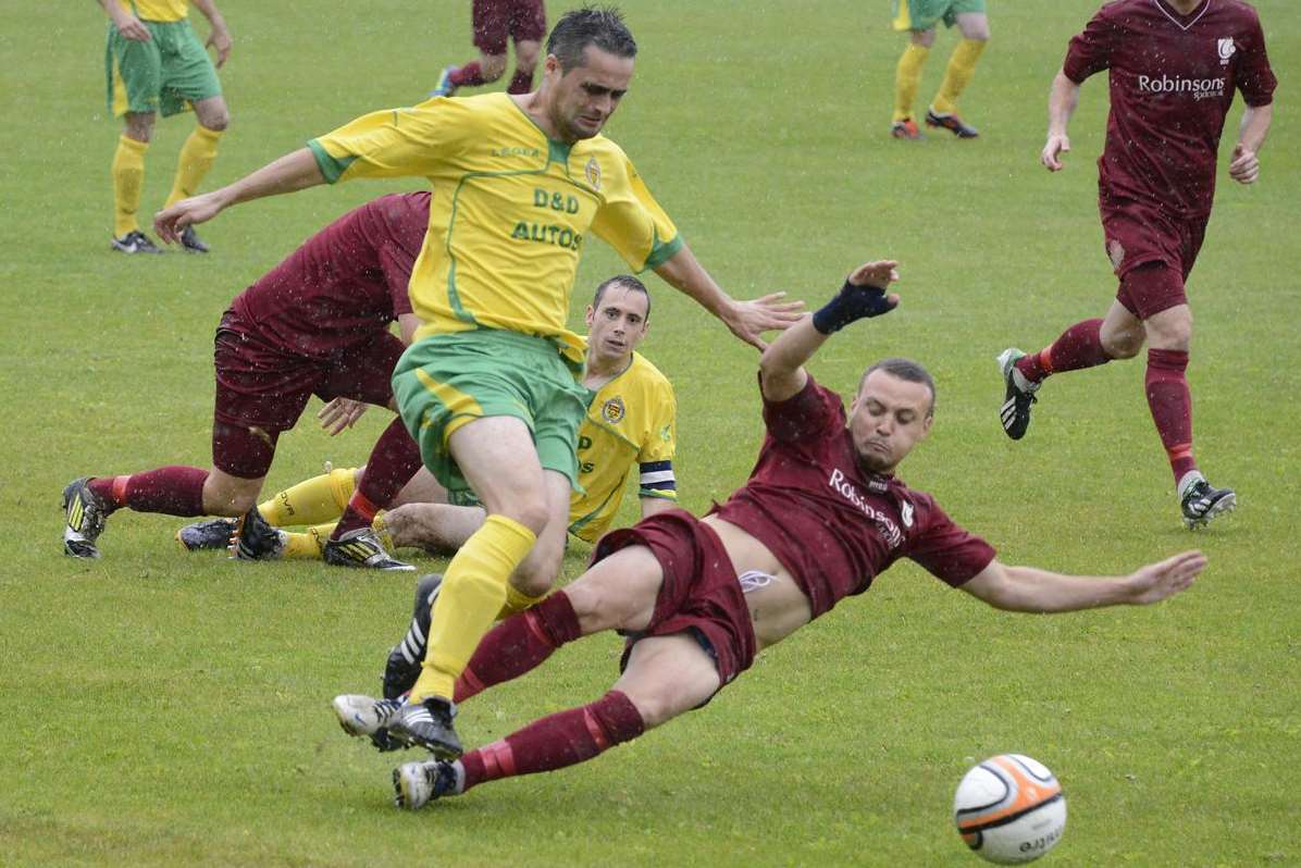 Canterbury City's Kane Hemmings slides in on Ashford's Gary Mickelborough on Monday Picture: Paul Amos FM3368388