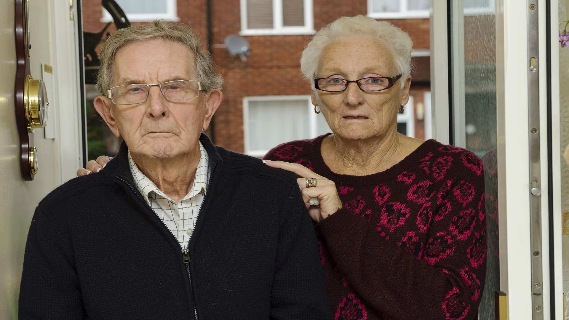 Kenneth with wife Mavis. He needs the scooter to make longer trips as he can only get around with sticks or a frame