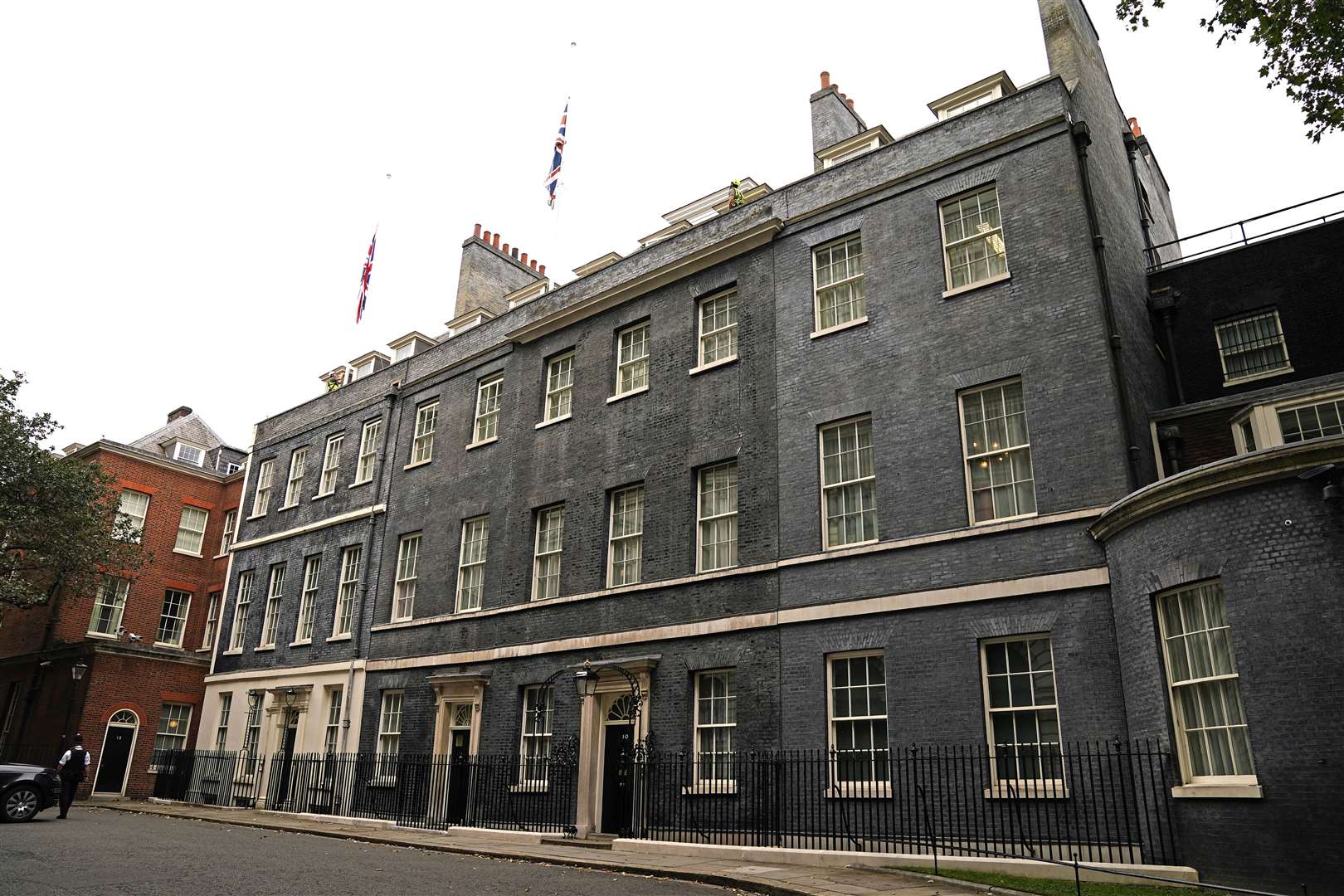 The Union flags above Downing Street have been lowered to half-mast (Aaron Chown/PA)