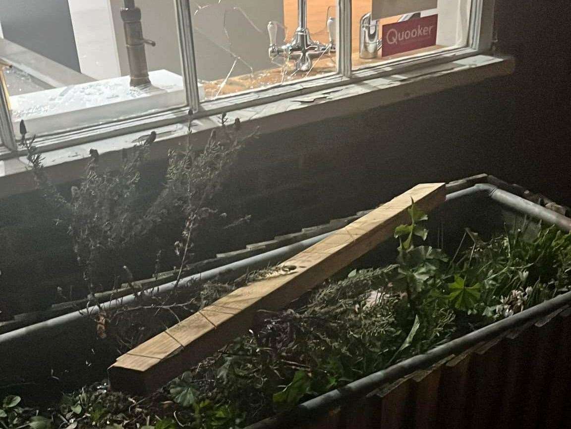 A piece of wood left near the smashed windows at Kitchens Unlimited in Tenterden. Picture: Steve Baker