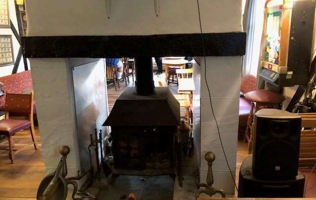 There is a two-sided wood burner which divides the front part of the pub from a smaller section at the back, reserved for viewing the projector screen