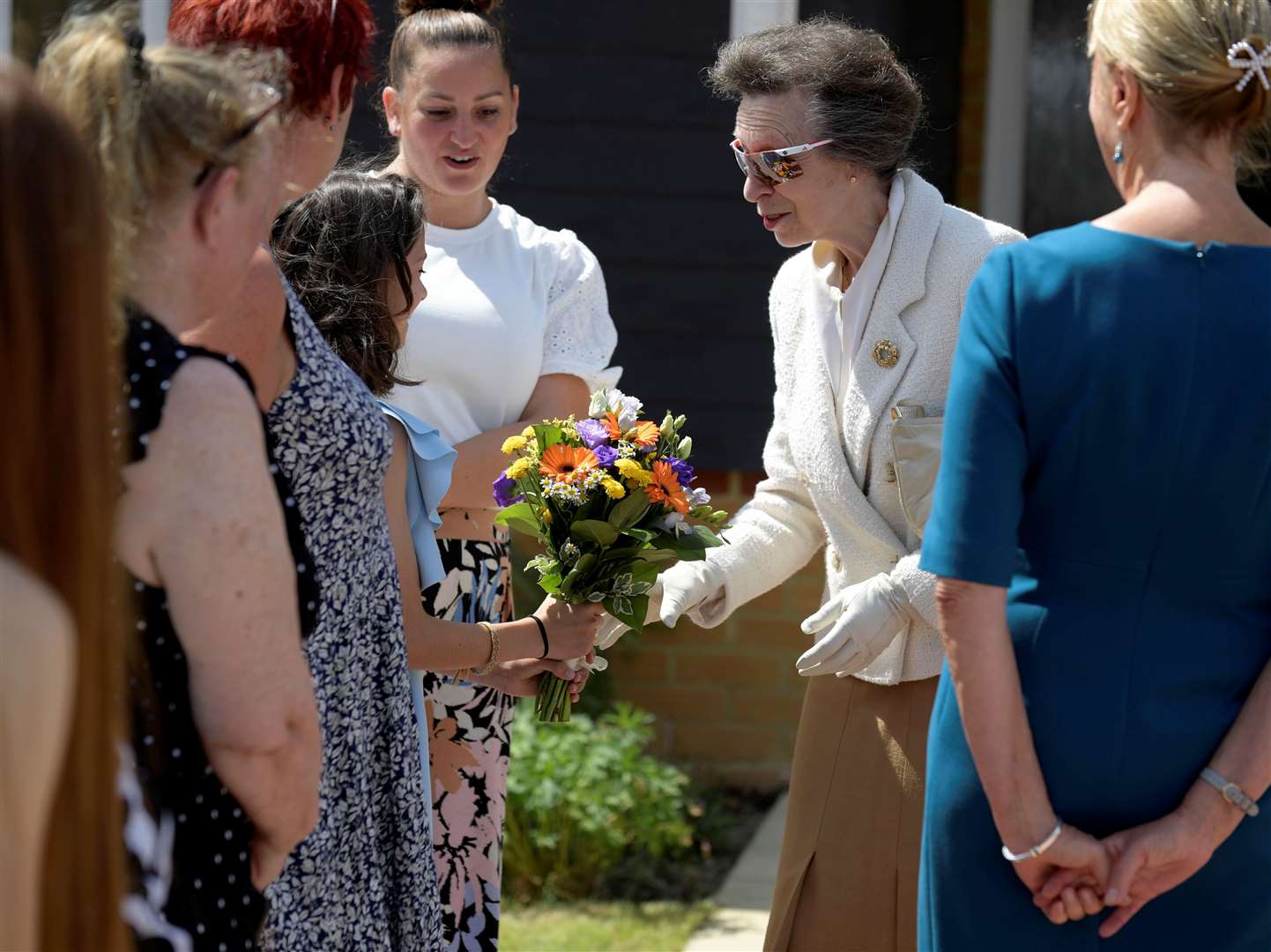 Princess Anne is presented with flowers by 12 year-old Lacey Fordham. Picture: Barry Goodwin