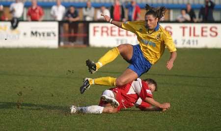 HEAVY CHALLENGE: the Welling defender upends his opponent. Picture: ANDY BARNES