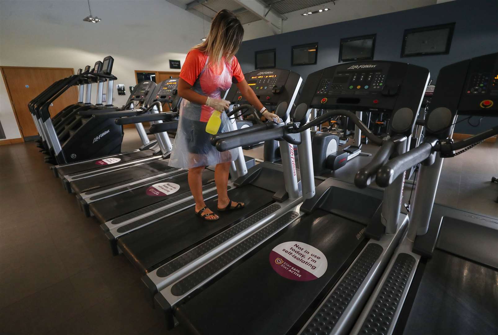 Gym equipment is cleaned prior to reopening (David Davies/PA)