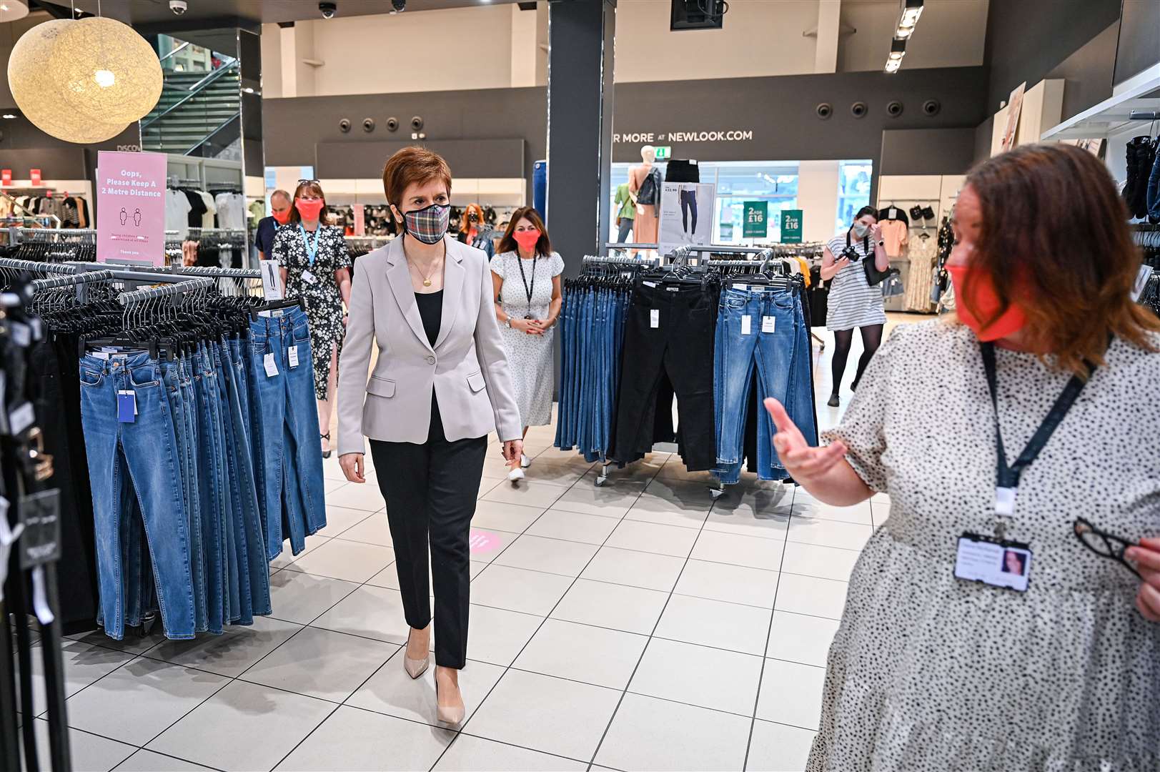 First Minister Nicola Sturgeon, wearing a tartan face mask during a visit to New Look at Ford Kinaird Retail Park in Edinburgh (Jeff J Mitchell/PA)