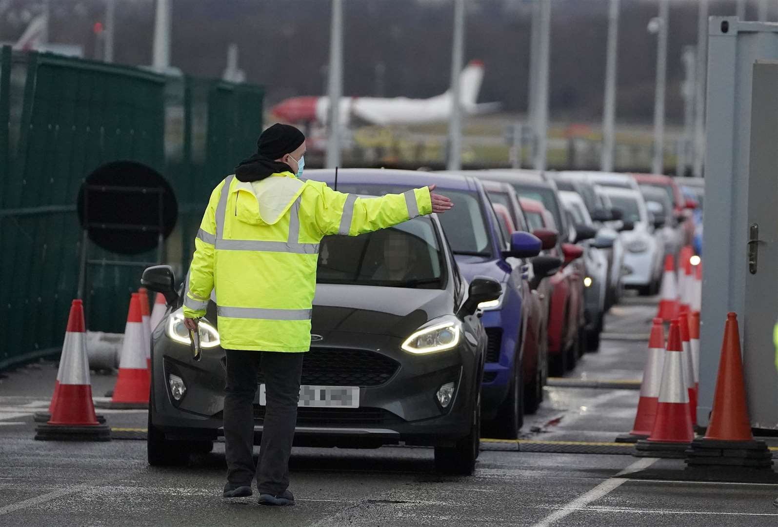 Cars queued on entry to a test centre at Edinburgh Airport (Andrew Milligan/PA)