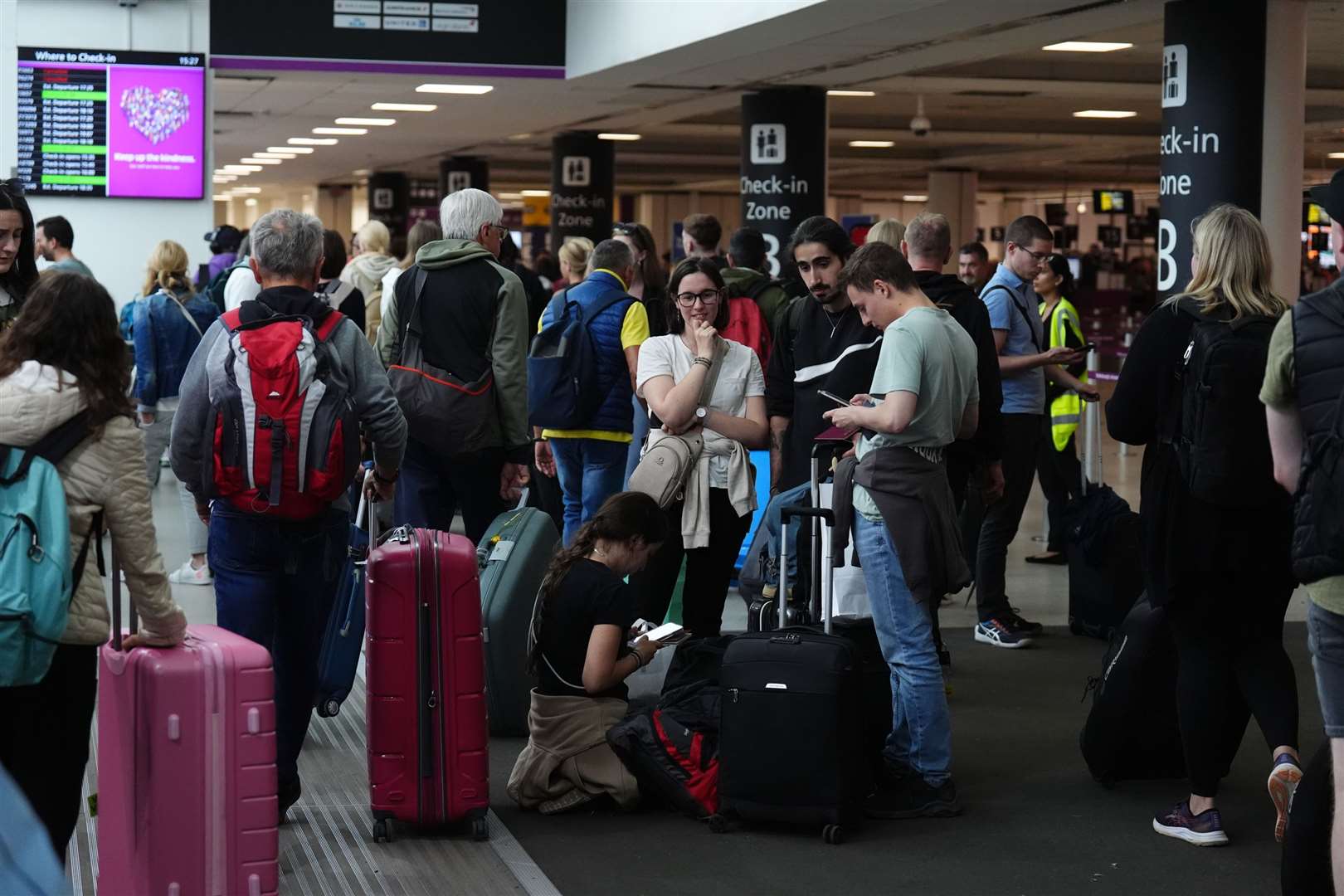 The outages led to long queues at airports (Andrew Milligan/PA)