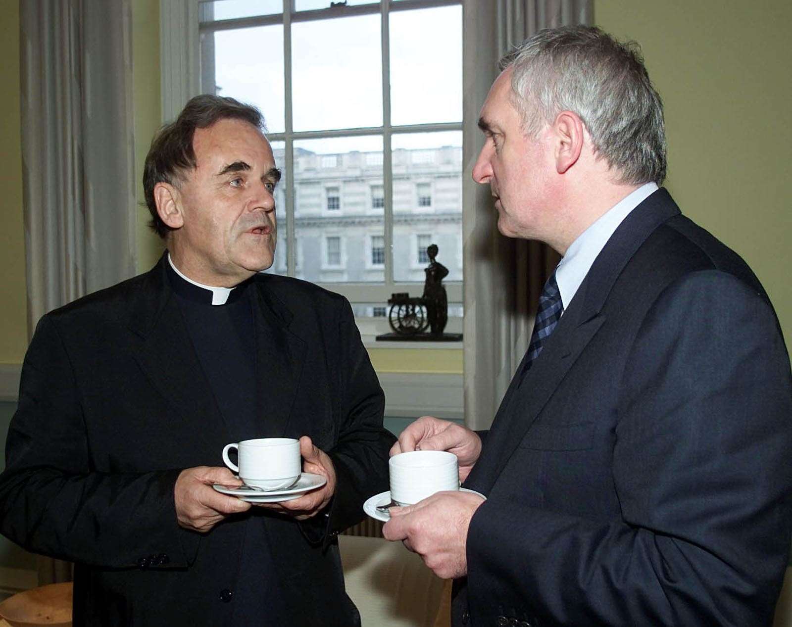 Irish Prime Minister Bertie Ahern talks with Father Aidan Troy, the Chairman of the Board of Governors of Holy Cross Primary School, Ardoyne, Northern Ireland, at Government buildings in Dublin (Chris Bacon/PA)