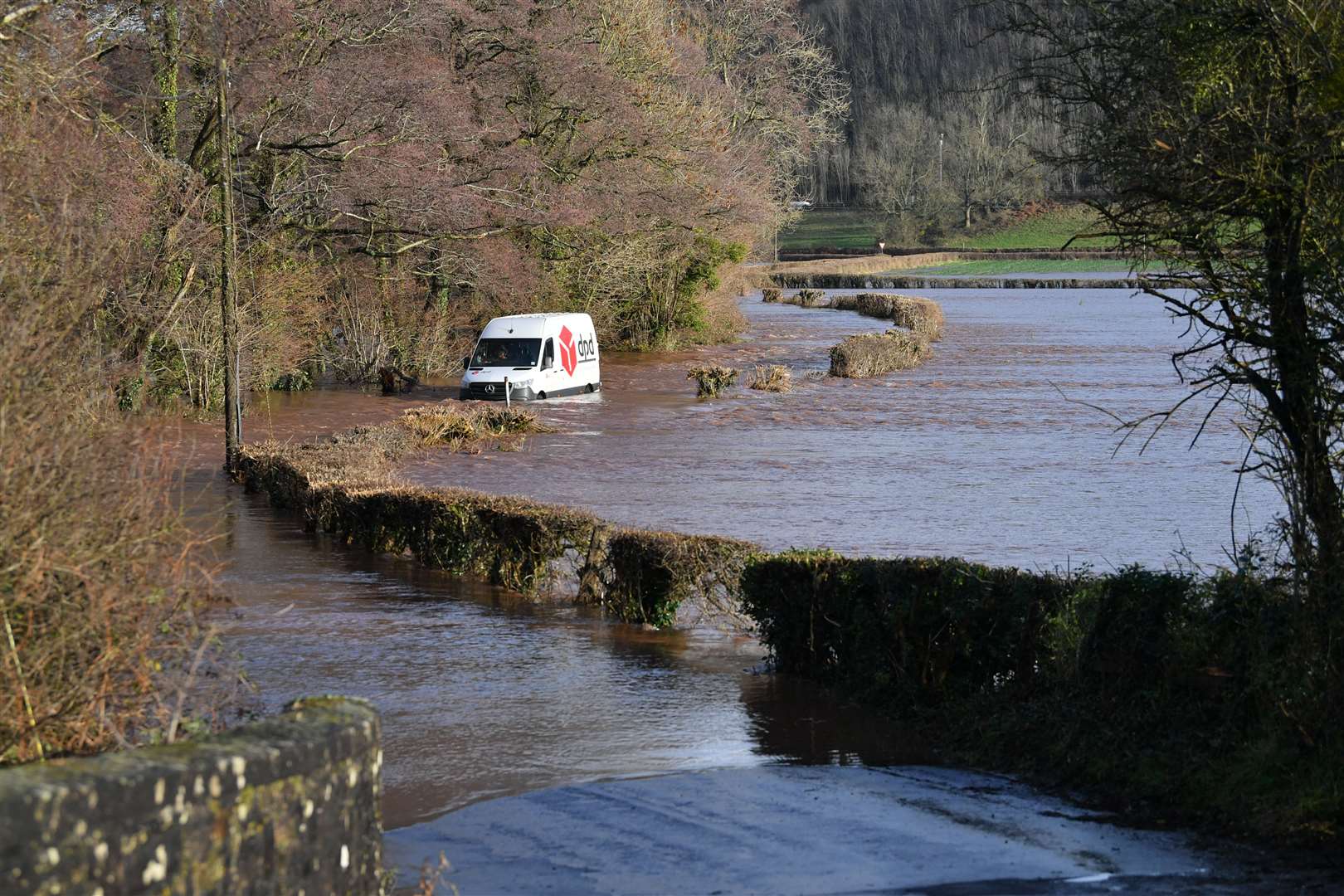 A DPD delivery van was stranded in flood water in Newbridge on Usk (Ben Birchall/PA)